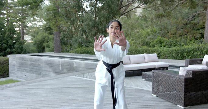 Lifestyle videos outdoor of people doing activities , practicing martial arts, woman in white karate