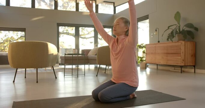Lifestyle videos indoor of people doing activities at home, practicing yoga, woman meditating on yog