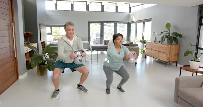 Lifestyle videos indoor of people doing activities at office, exercising at home, man and woman lift