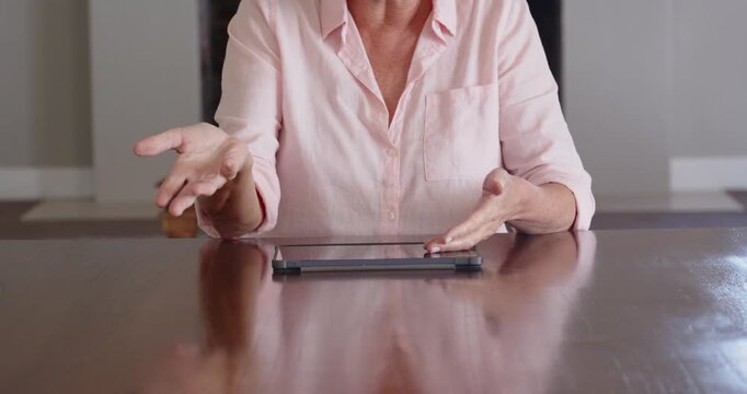 Lifestyle videos indoor of people doing activities at home, Using tablet on wooden table, woman in p