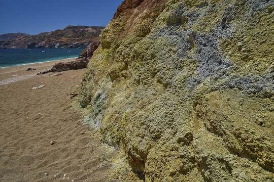 Beach with colorful rocks near a clear sea and sunshine, Paliochori beach, Paliochori, volcanic rocks, copper, nickel, mineral salts, volcanic island, Milos, Cyclades, Greek islands, Greece