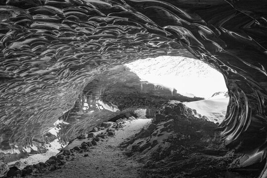 Filigree ice honeycombs at the entrance to the Pr&ouml;ng ice cave, black and white photo, Sudurland, Iceland