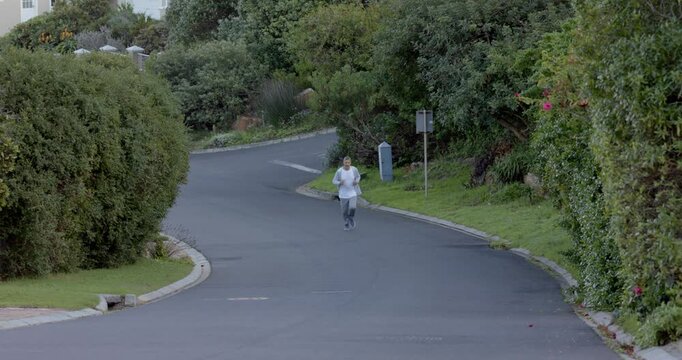 Lifestyle videos outdoor of people doing activities, running on suburban street, man exercising outd