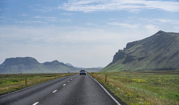 Car on the ring road, landscape with mountains, Iceland