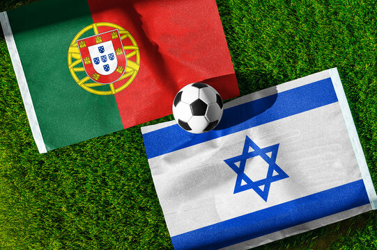Portugal vs. Israel football match. National flags on green grass with soccer ball in the middle. Football background for international match.