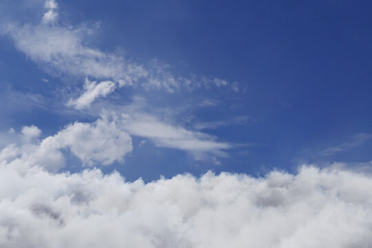  3D Rendering of a  beautiful cloudscape with blue sky covered by fluffy white clouds.