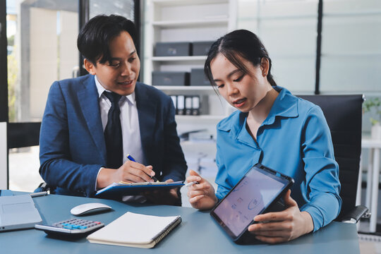 Business professional analyzing financial data on digital tablet dashboard with calculator and laptop, representing accounting software, ERP system integration, performance monitoring.