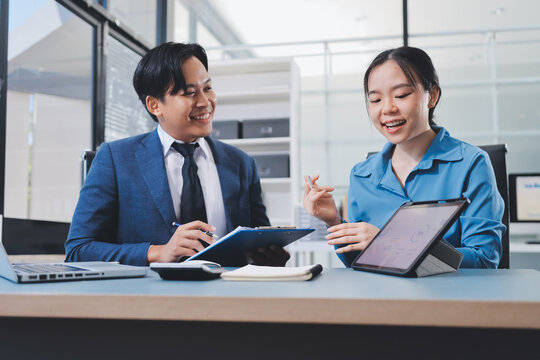 Business professional analyzing financial data on digital tablet dashboard with calculator and laptop, representing accounting software, ERP system integration, performance monitoring.