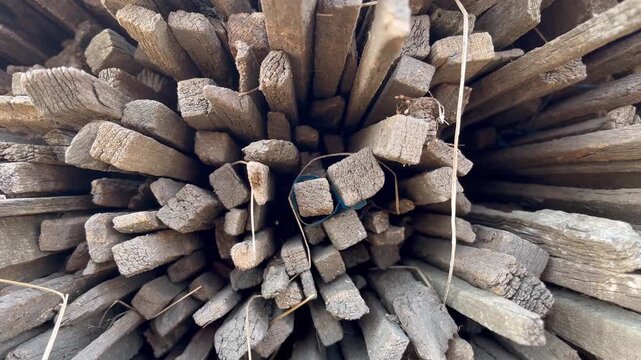 Dry weathered wood firewood logs texturing background