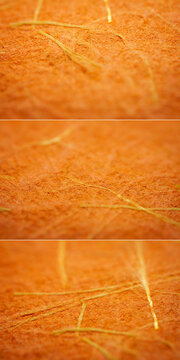 Collection of images with extreme closeups of orange handmade paper