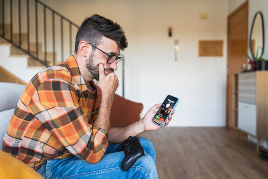 Man avoiding boss call for gaming sick day