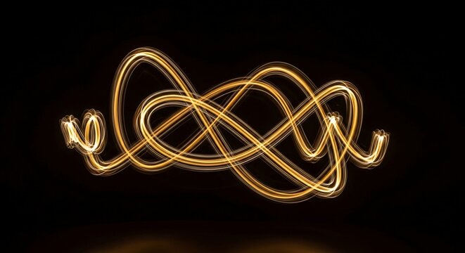 Mesmerizing Golden Light Trails Creating an Abstract Swirling Pattern on a Dark Background