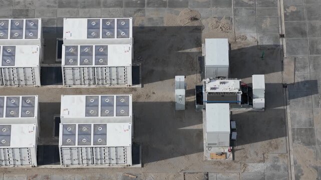 Aerial drone view of Cleve Hill Solar Park near Faversham, Kent, showing large-scale renewable electricity generation, battery storage and modern solar infrastructure.