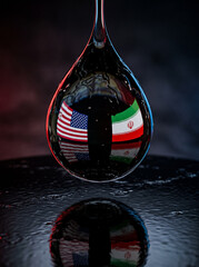 Obraz premium a close up of an oil drop reflecting the usa and iran flags inside against a dark background
