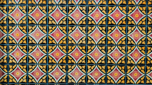 Thai ceramic tiles pattern background of antique traditional vintage oriental floral geometric art texture.