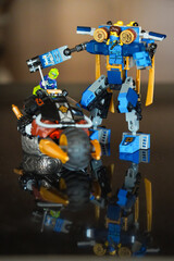 Obraz premium LEGO Ninjago mech and motorcycle battle scene displayed as a toy construction set, illustrating the popular building toy and entertainment franchise. February 3, 2021 - Abu Dhabi, UAE.