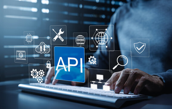 API Application Programming Interface software integration concept. Developer typing on keyboard with icons representing API development, security, cloud computing, application software tool, web API,