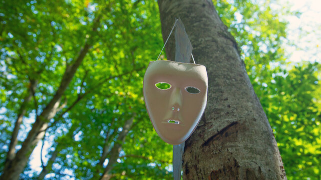White mask in the forest.