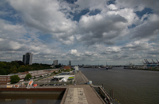 Hamburg port industry cityscape with moving cargo ship