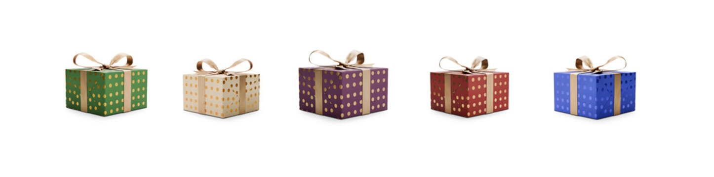 A collection of red, green, blue, purple and cream gift wrapped presents with gold ribbon bows isolated against a transparent background.