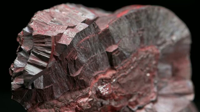 Hematite or Haematite (principal ore of iron) 'kidney ore' - sample against a black background.