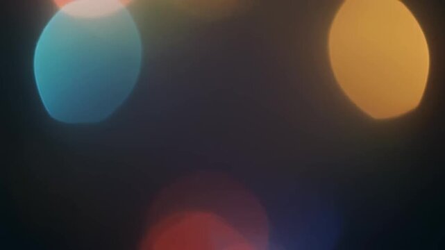 Overlapping Bokeh Circles Creating Soft Colorful Glowing Light Effects Against Dark Background For Abstract Creative Design Background And Glowing Backdrop