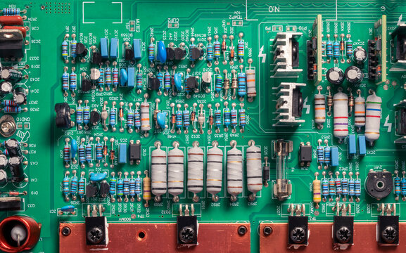 Top view, electronic circuit board, transistors, resistors, capacitors, and diodes on the printed of an amplifier circuit board