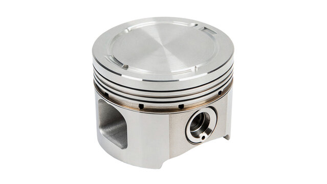 Metallic car engine piston hardware component isolated on dark background