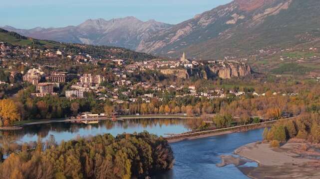 Aerial view of Embrun and Serre-Poncon Lake with the Durance River in autumn. Scenic alpine landscape in the Hautes-Alpes region of the French Alps. France