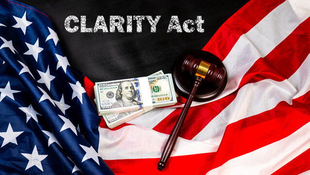 Flag of the United States of America alongside cash and a wooden gavel, symbolizing regulation in the Clarity Act. 
Concept represents the Digital Asset Market Clarity Act cryptocurrency governance. 