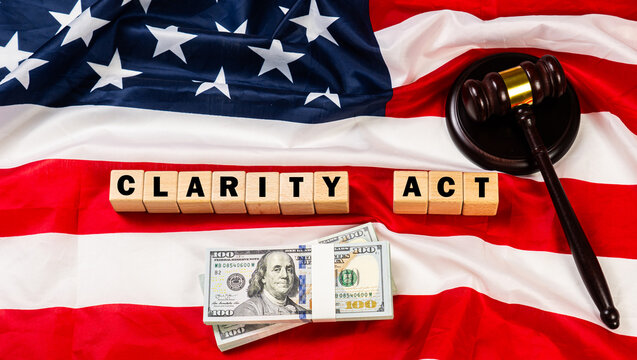 Flag of the United States of America alongside cash and a wooden gavel, symbolizing regulation in the Clarity Act. 
Concept represents the Digital Asset Market Clarity Act cryptocurrency governance. 