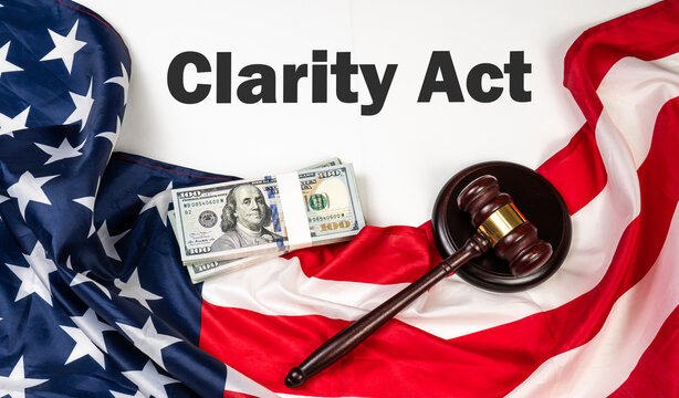 Flag of the United States of America alongside cash and a wooden gavel, symbolizing regulation in the Clarity Act. 
Concept represents the Digital Asset Market Clarity Act cryptocurrency governance. 