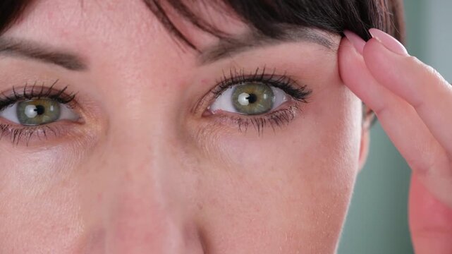 The woman has a drooping eyelid
