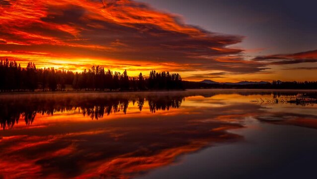Fiery Morning Sunrise Reflected on Yellowstone Lake in Yellowstone National Park