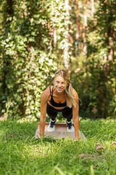 Woman Doing Plank Exercise Outdoors for Core Strength