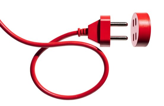Red electrical plug and socket isolated on white background with electric socket