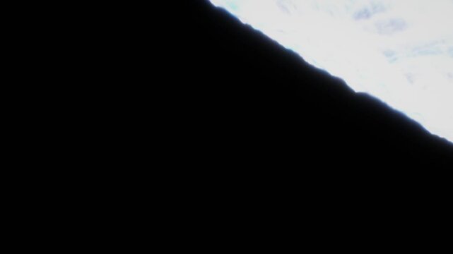 Luminous white and soft cyan mist veil flows diagonally across the upper frame over a pure black backdrop in a 3D render