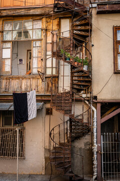 facade of an old Soviet apartment building with a spiral staircase, Tbilisi, Georgia, Asia