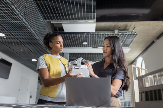 Women Engaging Over Virtual Reality Device