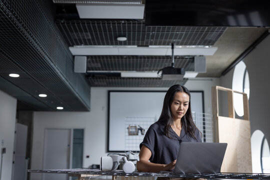 Woman analyzing VR tools in a contemporary workspace