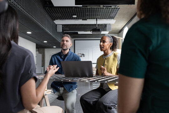 Group of engineers discussing developments in technology