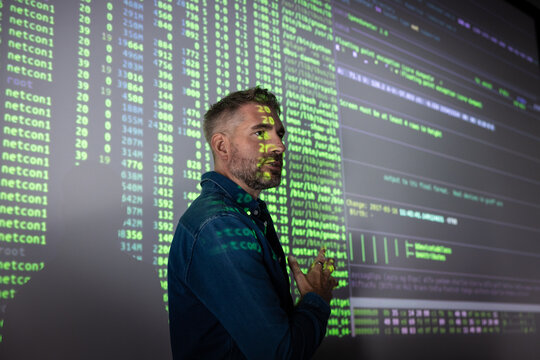 AI engineer giving a presentation with a large screen