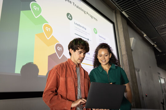 Students working on a business presentation together