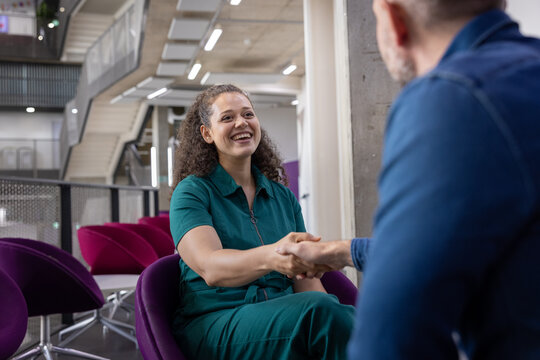 Handshake in a casual meeting with a young employee