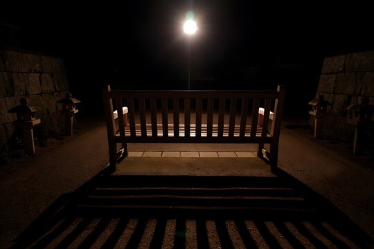 Empty wooden crib under warm lighting