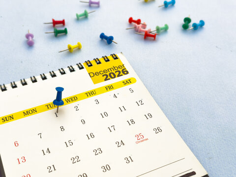 1st December date 2026 marked with push pin on calendar business event schedule concept.
