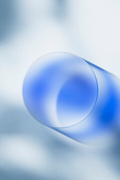 Minimal Blue Glass Sphere on Soft Abstract Background