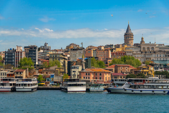 Panoramic view of Galata tower and urban cityscape along the golden horn waterfront in istanbul turkey