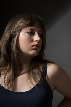 Beautiful teenage girl posing in beauty style on dark background