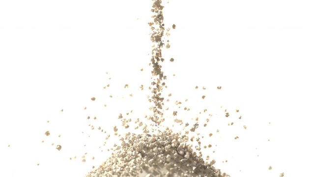 Falling vertical column of beige granules forming rounded pile at studio base, with airborne halo